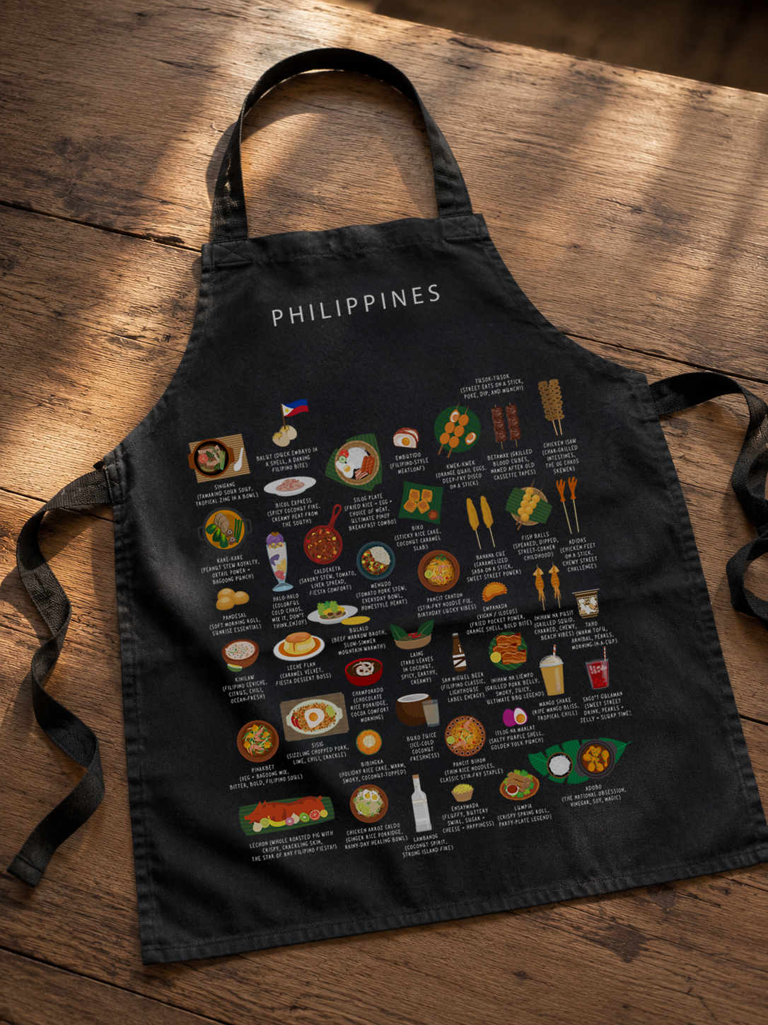 Maison Maps Philippines apron styled on a warm wooden kitchen table